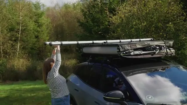 Outwell Bamfield 160 roof tent being unfolded