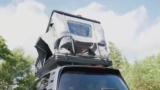 Outwell Coombs 135-X open rooftop tent and sleeping area detail