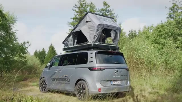 Outwell Coombs 135-X hard-shell roof tent erected on a vehicle